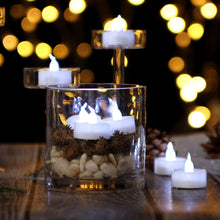 Load image into Gallery viewer, AGPtEK 24pcs Timer Flickering Flameless LED Candles Battery-Operated Tealights for Wedding Holiday Party Home Decoration (Cool White)